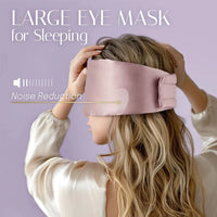 Woman wearing a large pink mulberry silk sleep mask