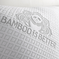 Close-up of the quilted bamboo pillow cover with the Bamboo is Better logo