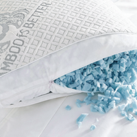 Adjustable bamboo cooling pillow with the zipper open, showing shredded blue memory foam fill